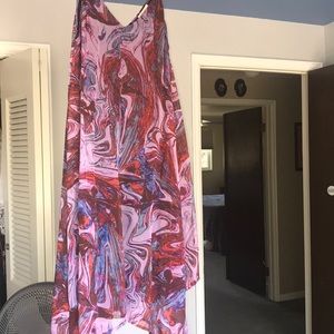 A medium length, flowy purple dress